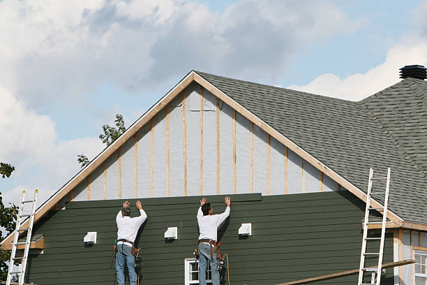 Professional Storm Damage Siding Repair technician working in Ashland, IL